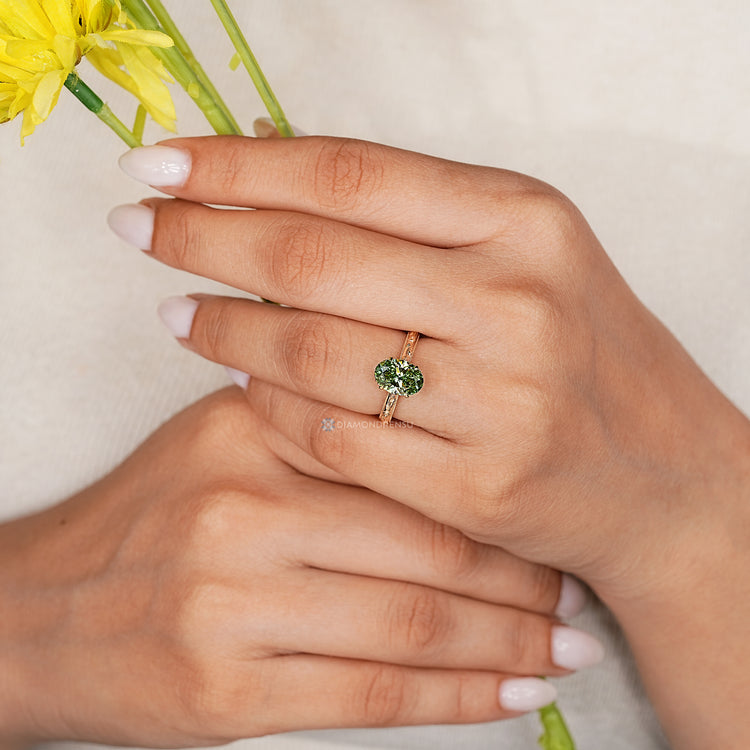 Handmade oval diamond ring with cathedral setting.