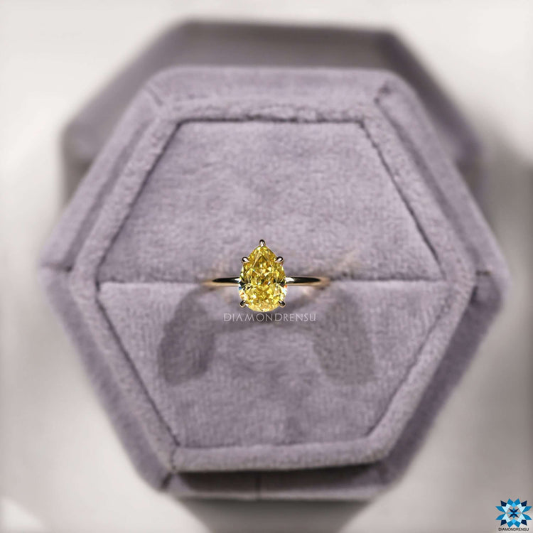 Yellow gold moissanite ring with 5 claw prong.