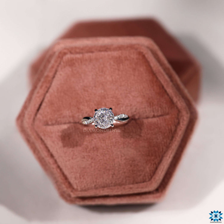 Custom engagement ring with Portuguese cut moissanite and 4 claw prong setting.