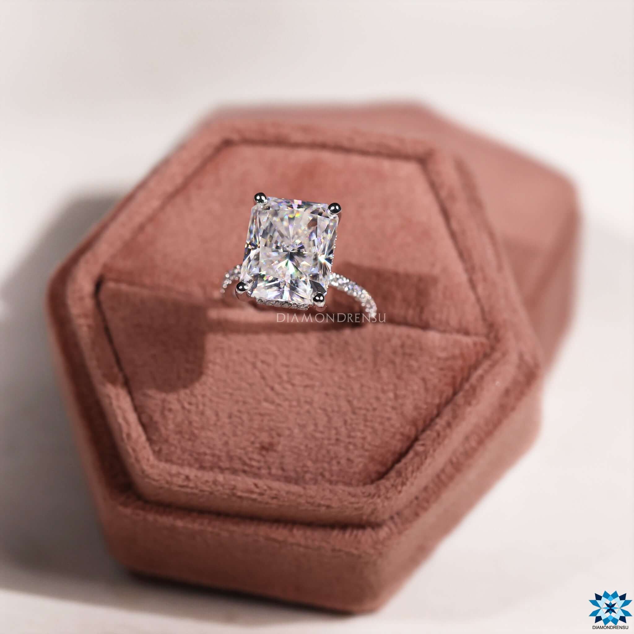 Hidden halo pave setting on white gold moissanite ring.