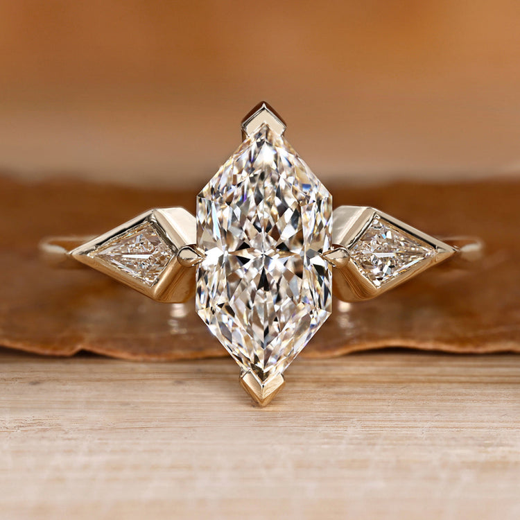 Dutch marquise ring with kite side stone.