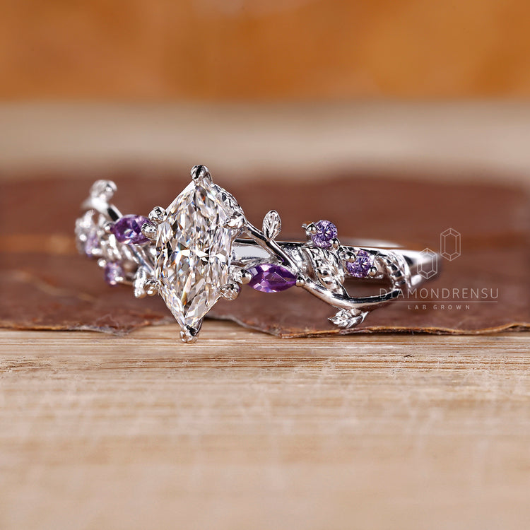 Lab grown diamond ring with tanzanite side stones.