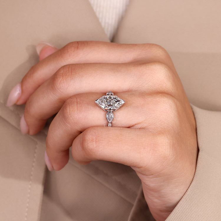 Euro shank marquise ring with pear side diamonds