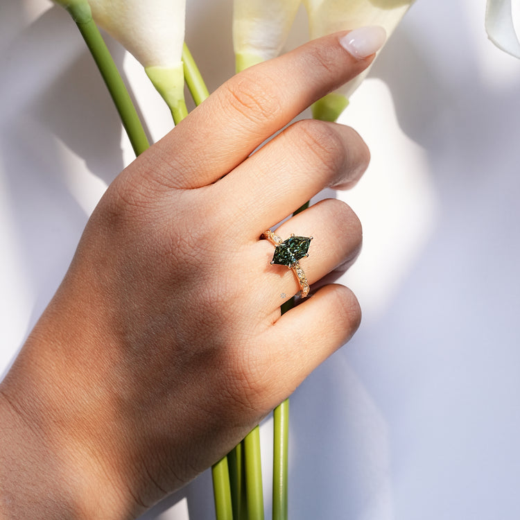 Handmade vintage ring with round and marquise side stones.