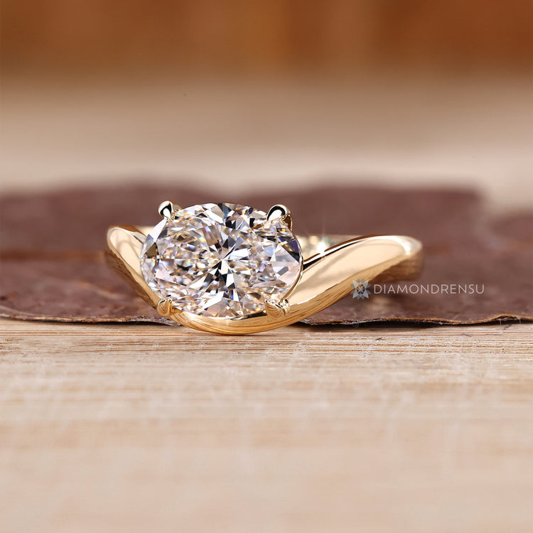 Handmade solitaire ring with oval cut lab grown diamond.