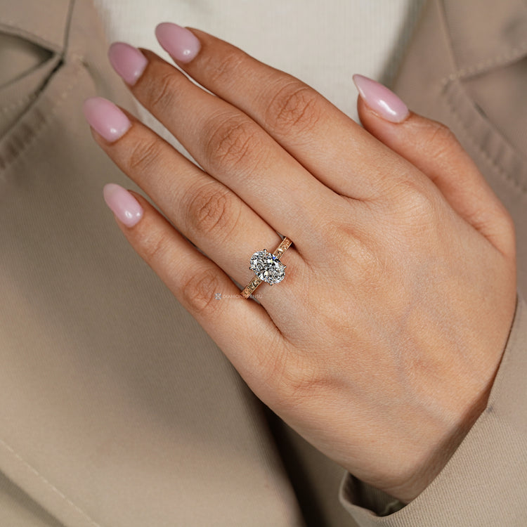 Oval cut ring with hidden bridge round diamond.