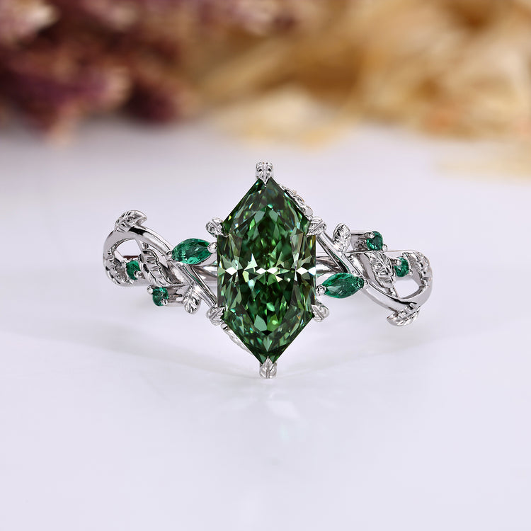 Nature inspired engagement ring with green Dutch marquise cut diamond.