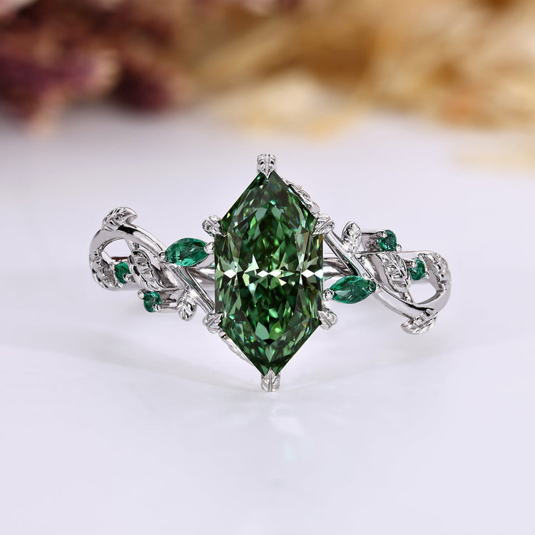Nature inspired engagement ring with green Dutch marquise cut diamond.
