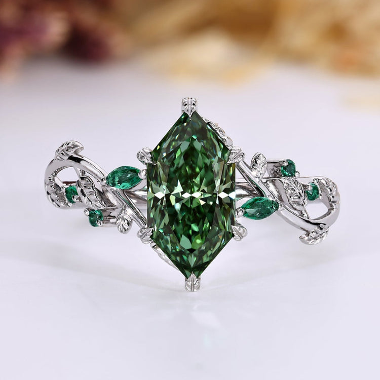 Nature inspired engagement ring with green Dutch marquise cut diamond.