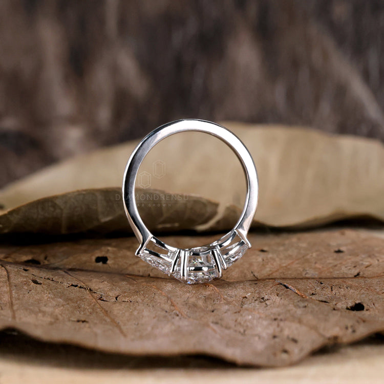 Pear shaped diamond ring with unique craftsmanship for elegance.