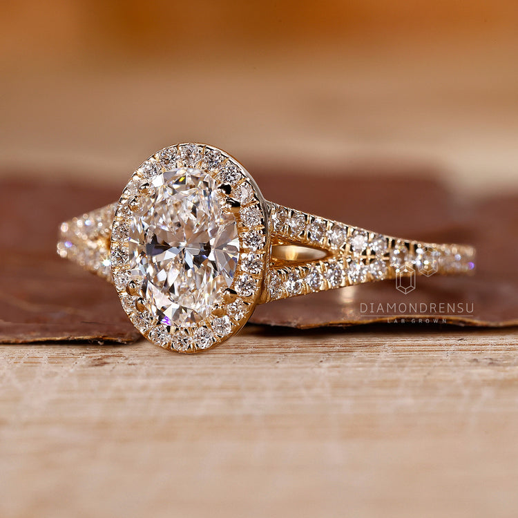 Oval cut diamond ring with round bridge accent stones.
