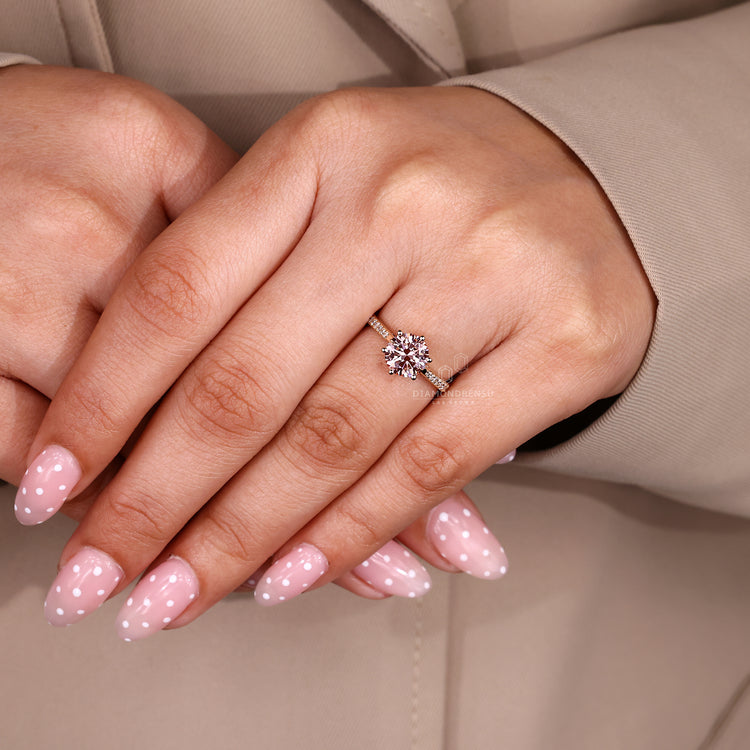 Round cut ring with cathedral and six prong setting.