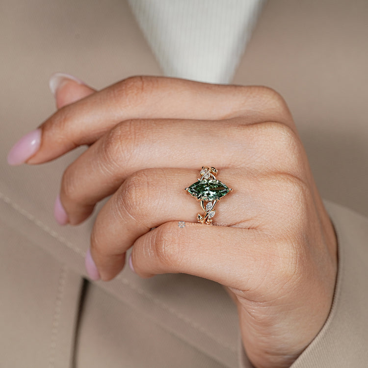 Marquise diamond ring with blooming flower bud setting.