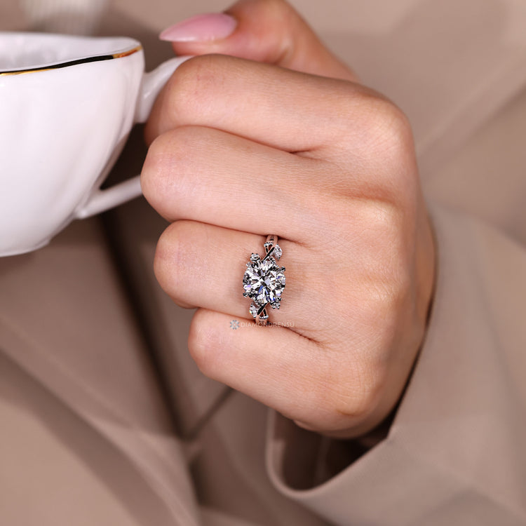 Handmade round cut diamond ring with nature inspired design.