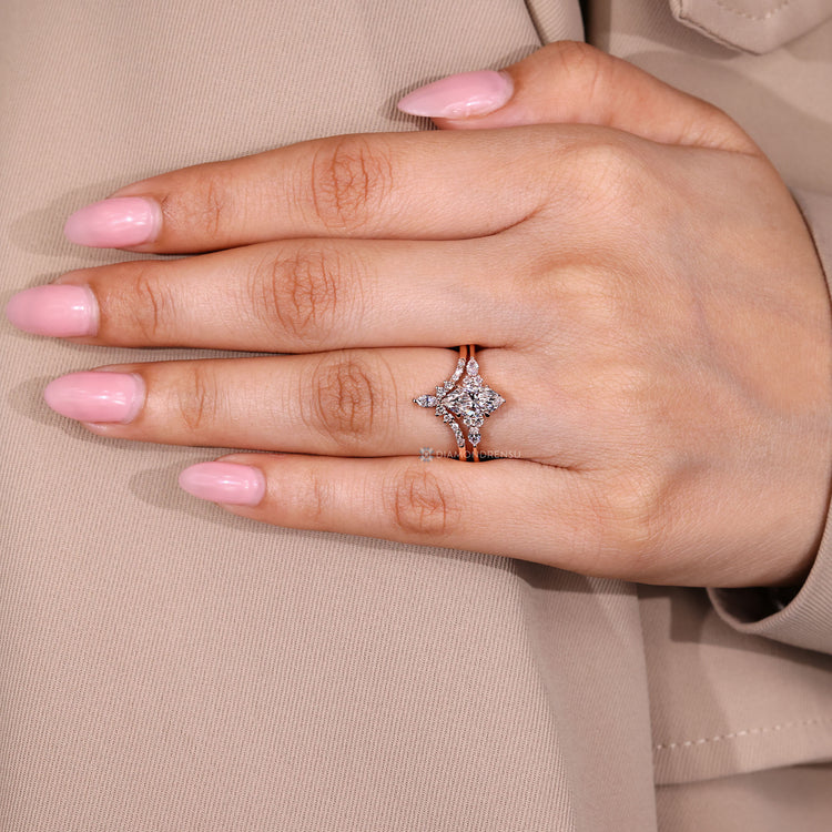 Marquise ring with six claw prong setting and curvy band.
