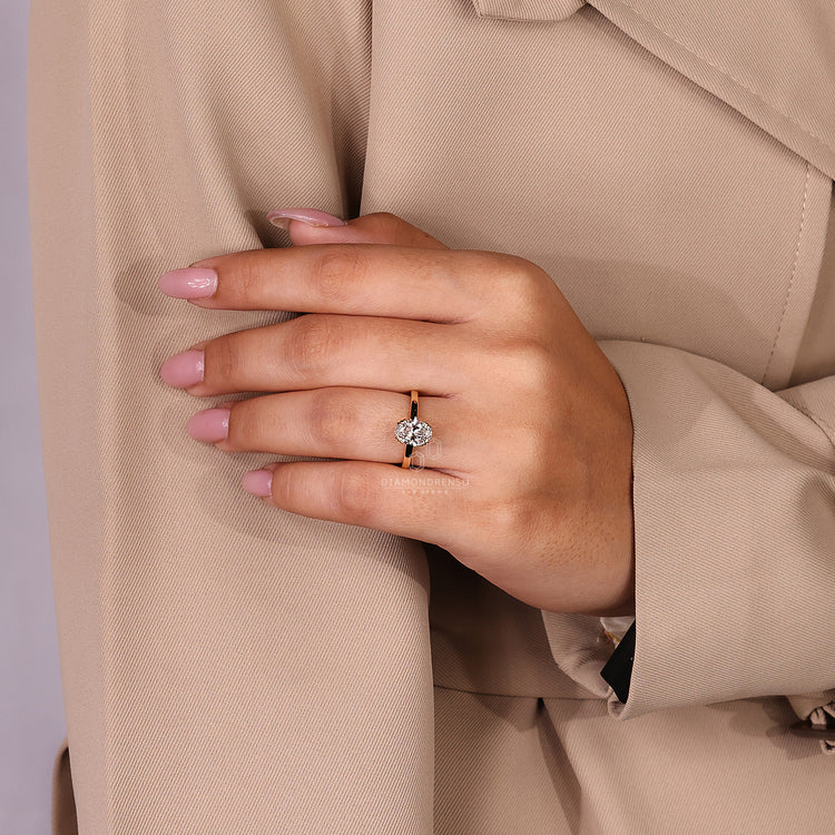 Lab grown oval diamond ring with triple prong setting.