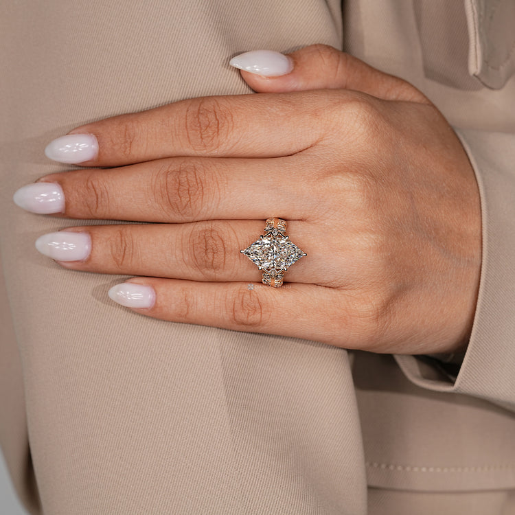 Cluster setting ring with marquise and round diamonds.