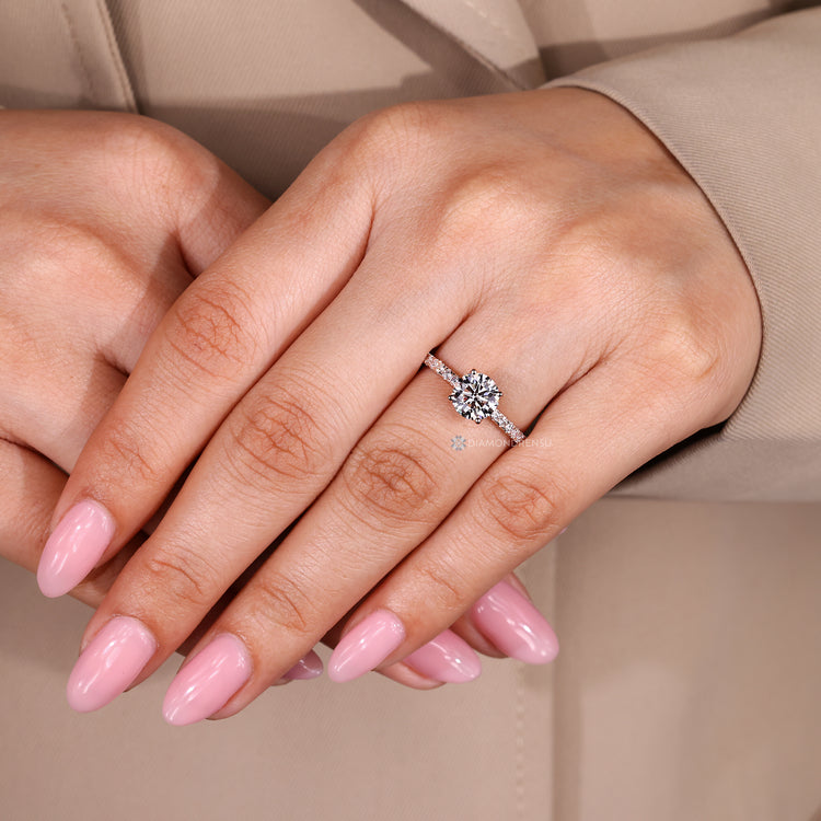 Handmade round diamond ring with four prong setting.