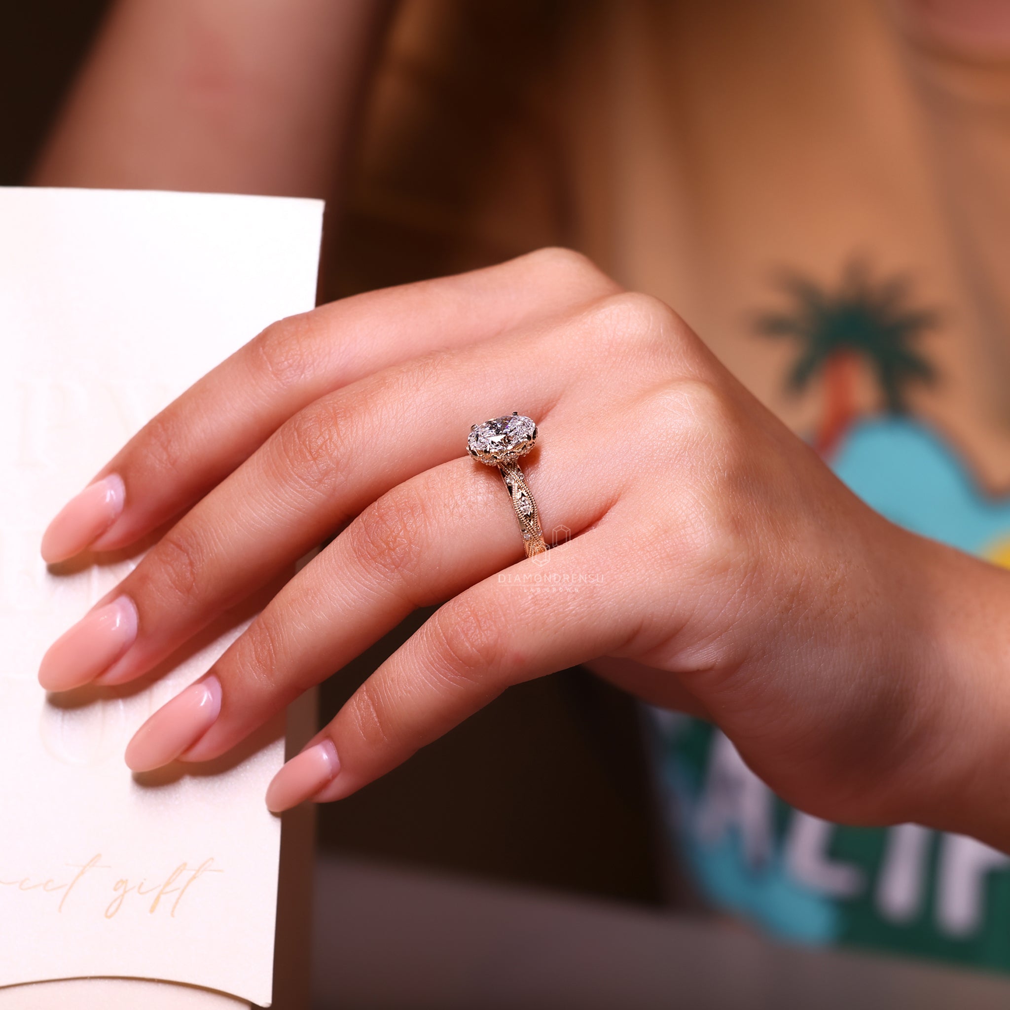 Art deco ring features oval cut and round diamond.