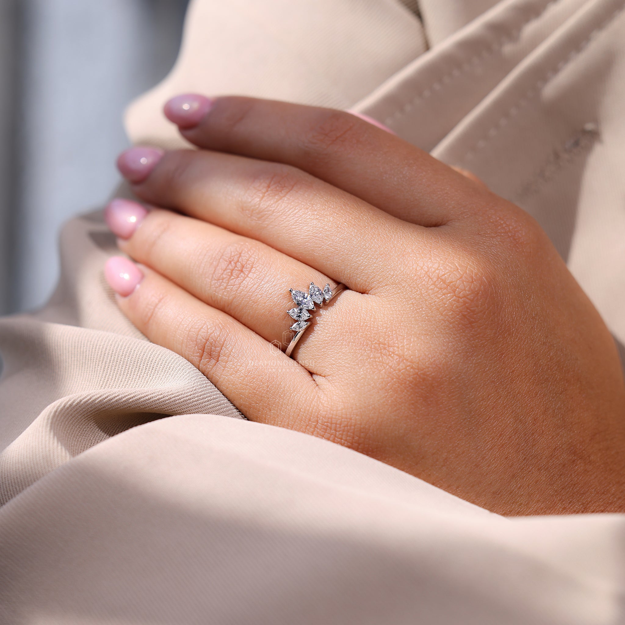 Curved diamond band with a simple and elegant five stone layout.