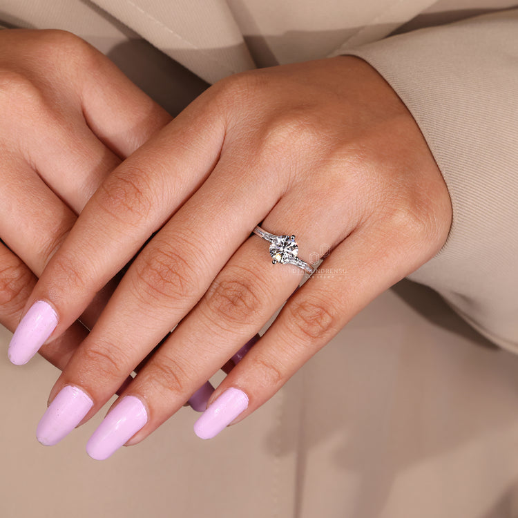 Lab grown diamond engagement ring in compass prong setting.