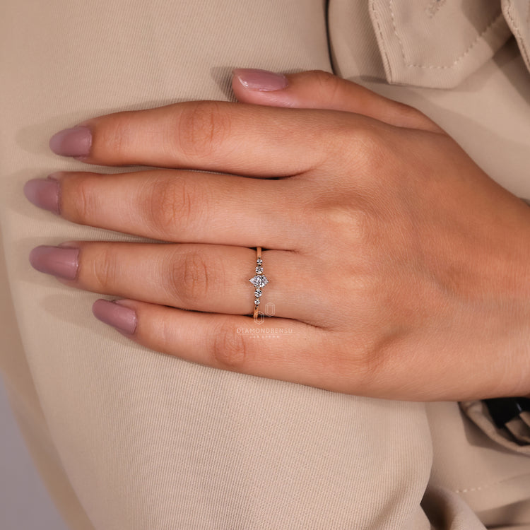 Six prong setting pear diamond ring with shared prongs