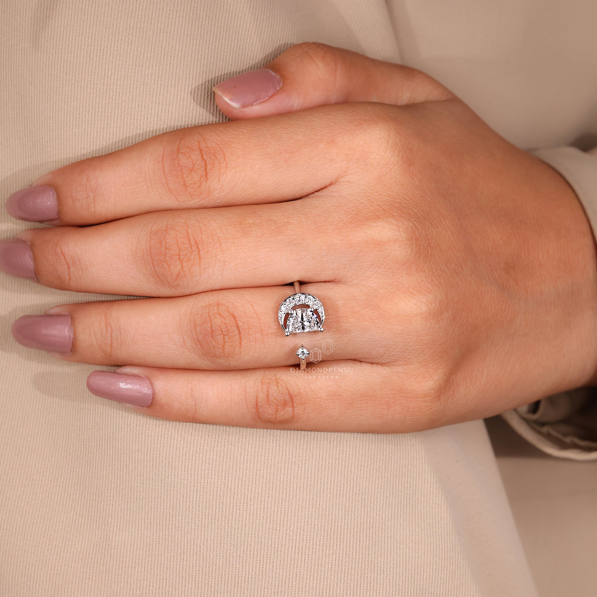 UK engagement ring with round and half moon diamonds