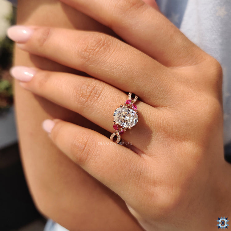 Handmade jewellery with oval moissanite centre and bold side stone accents.