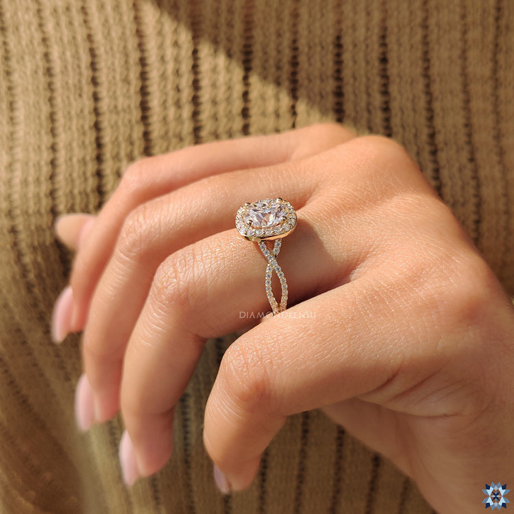 Moissanite engagement ring featuring yellow gold and round cut halo setting.