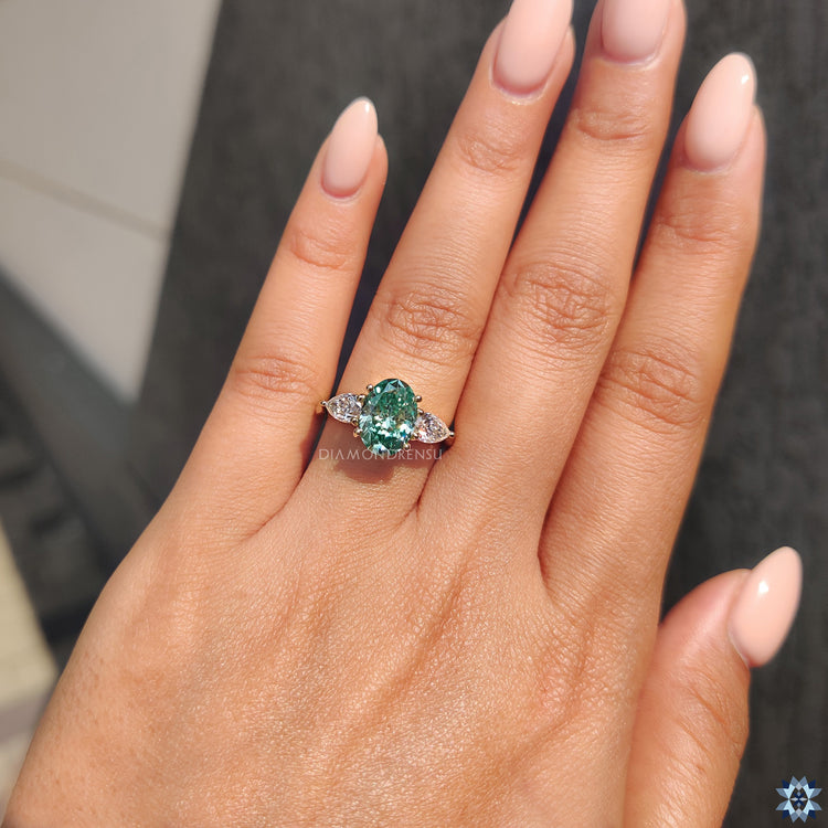 Pear and oval engagement ring in 4 prong ring setting