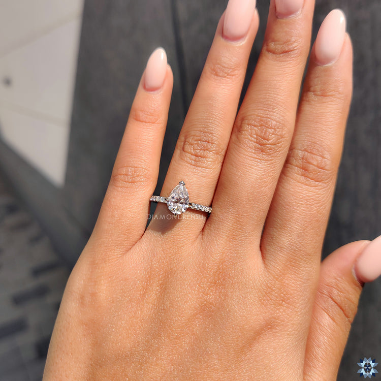 Round cut pave band featuring handmade moissanite and v shaped prongs.