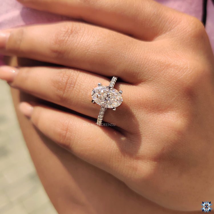 Oval cut ring in pave engagement ring style