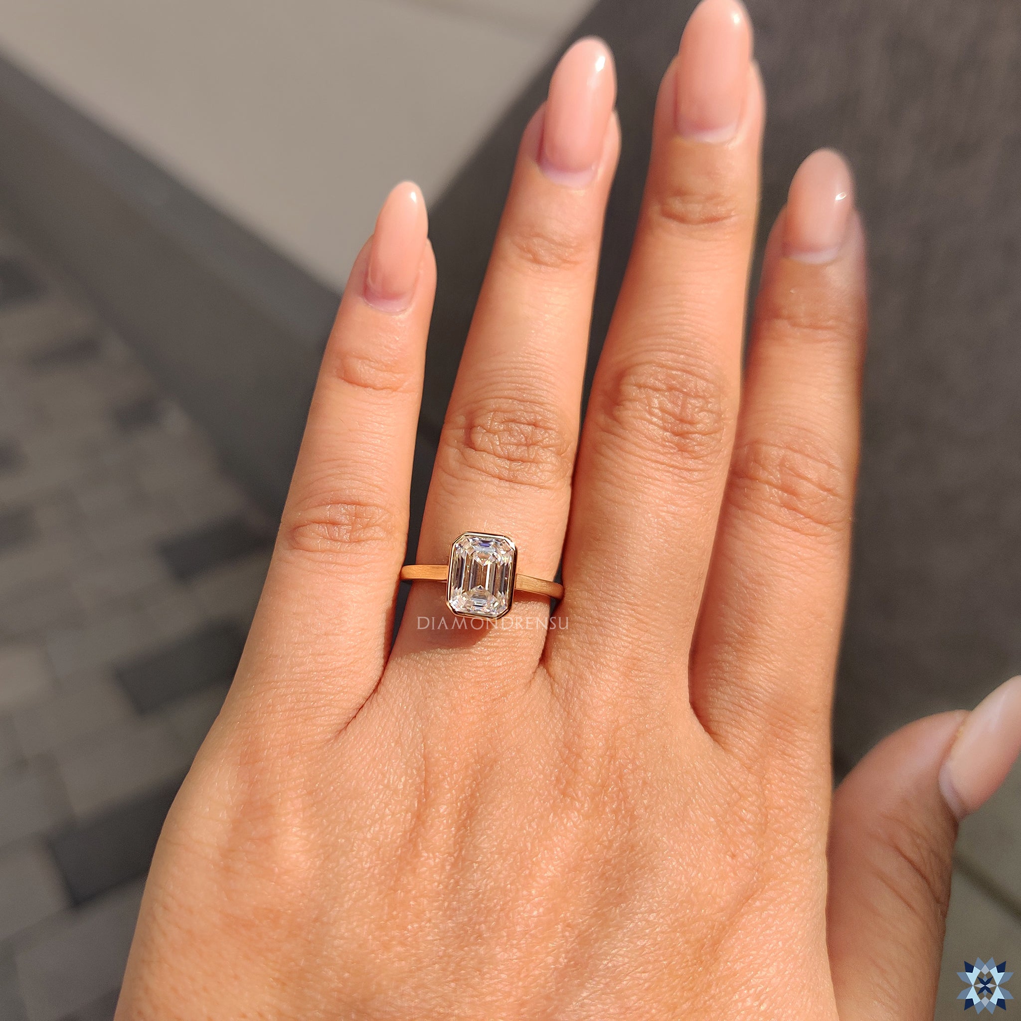 Yellow gold ring in bezel set engagement ring style