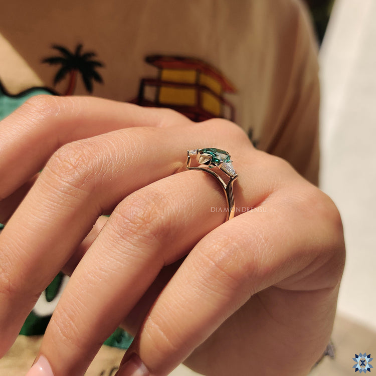 Diamondrensu UK engagement ring with V shaped prongs and cathedral mount.