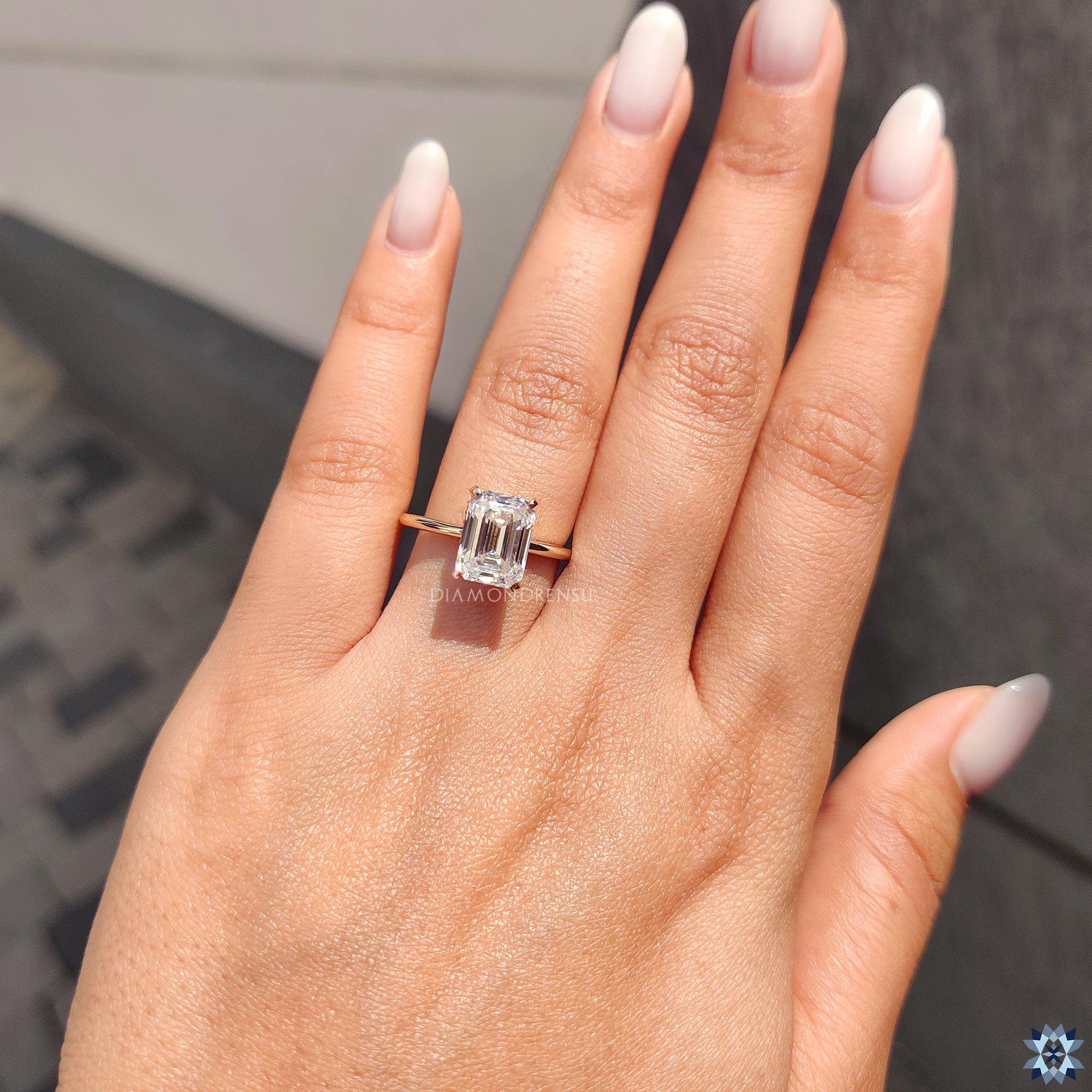 Buy moissanite ring from Diamondrensu UK with custom emerald cut design.