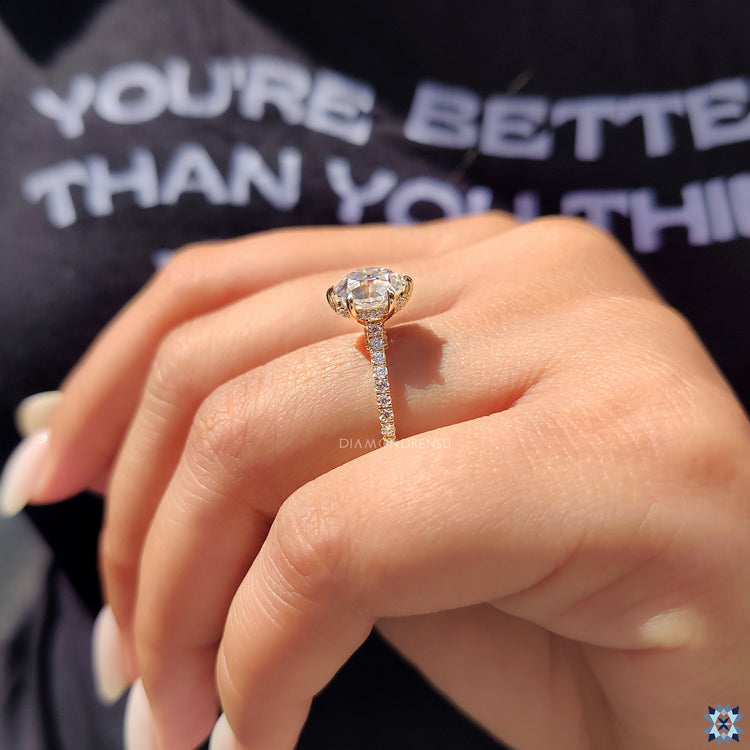 Moissanite ring UK crafted in yellow gold with a hidden halo design.