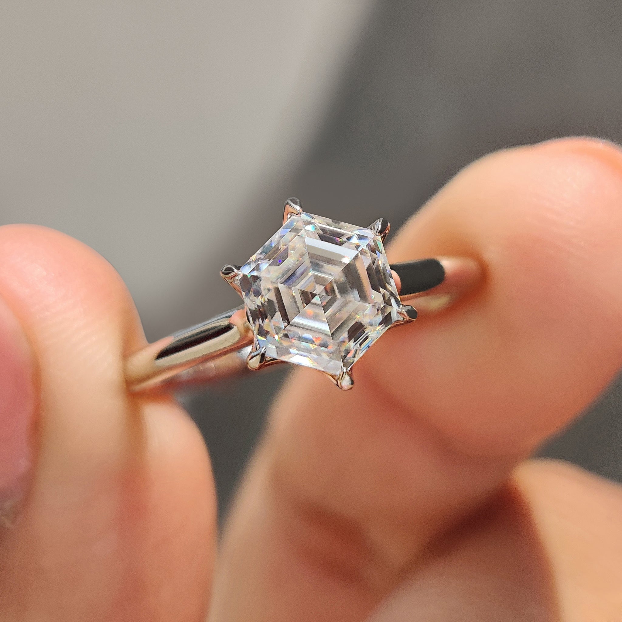 Hexagon moissanite ring crafted in white gold with a 6 prong claw setting.