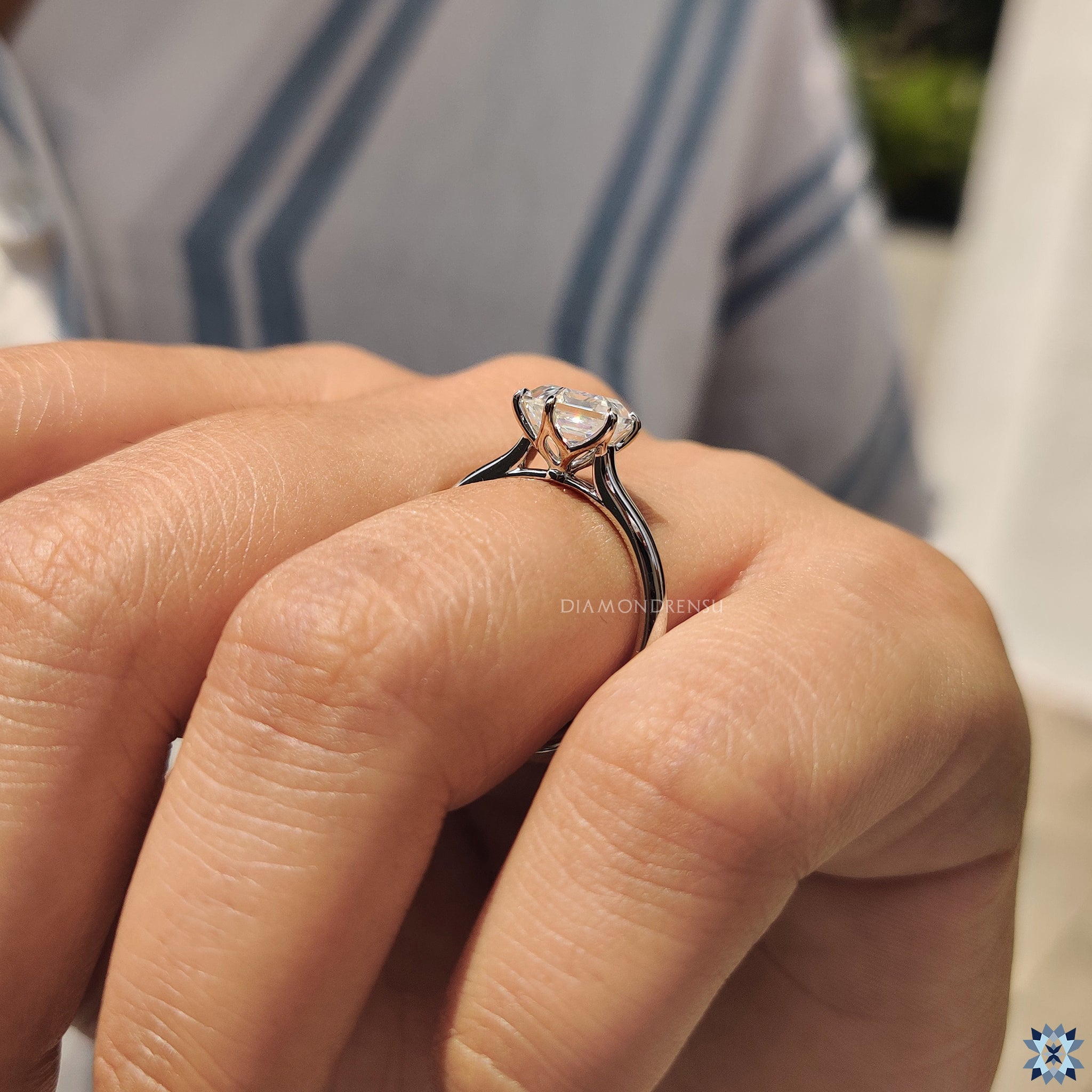 Handmade jewellery featuring a cathedral-style moissanite engagement ring.