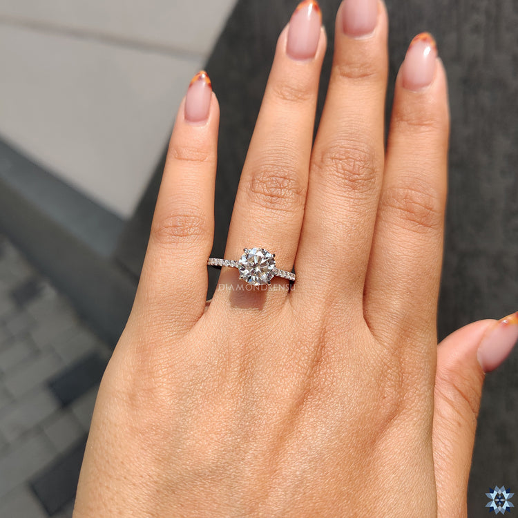 Handmade jewellery piece with round cut moissanite and cathedral shank.