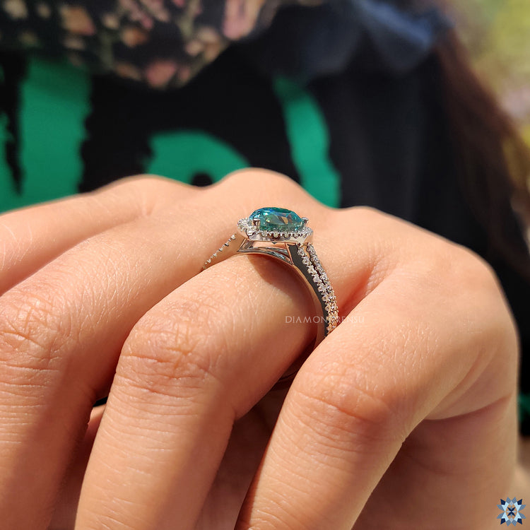 UK engagement ring with pear moissanite and white gold mount.