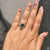 Cyan blue moissanite ring in bold radiant cut and prong mount.
 Cyan blue moissanite ring in bold radiant cut and prong mount.