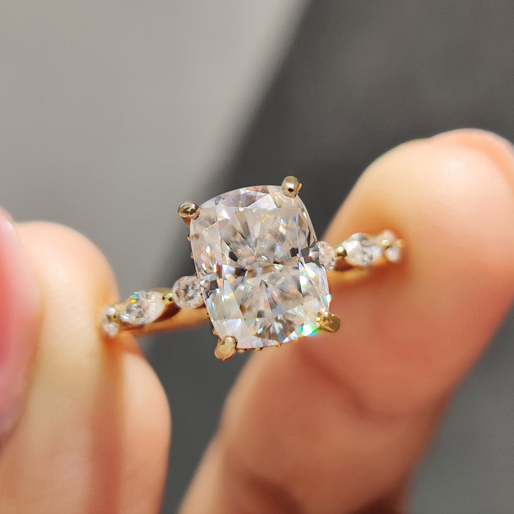 Cushion cut engagement ring with hidden halo setting and crushed ice moissanite center.