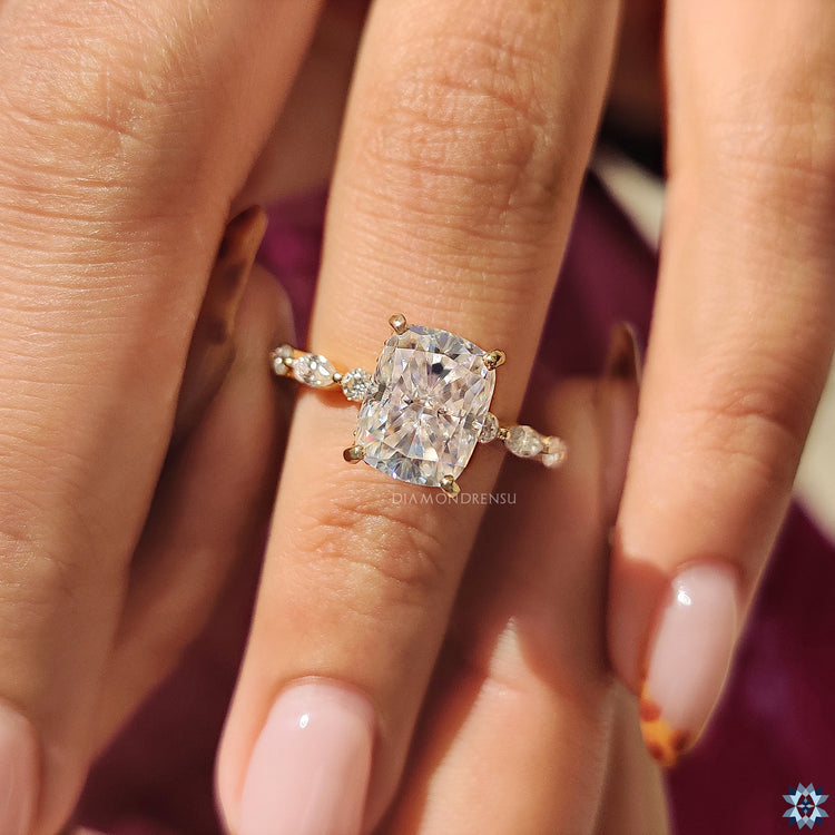 Hidden halo cushion moissanite ring with handmade marquise and round side stones.
