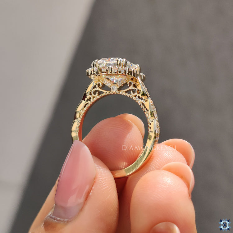 Handmade radiant cut engagement ring with round prongs and elegant vintage finish.