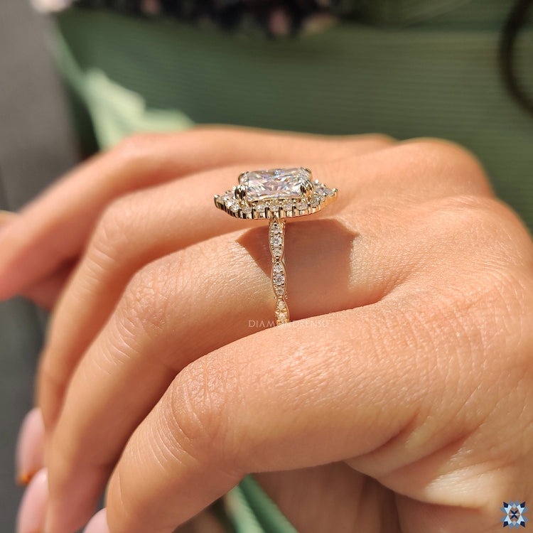 Moissanite for an engagement ring featuring double claw setting and peekaboo design.