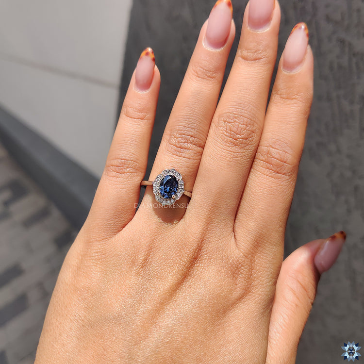 Vintage engagement ring featuring oval-shaped Moissanite and 4 round prong setting.