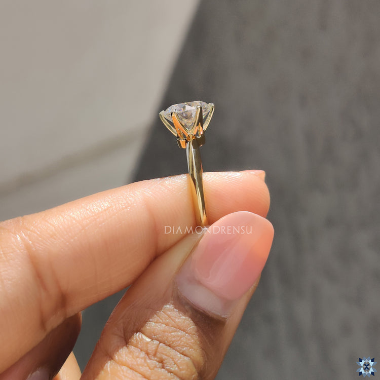 Moissanite for an engagement ring featuring timeless solitaire round cut design.