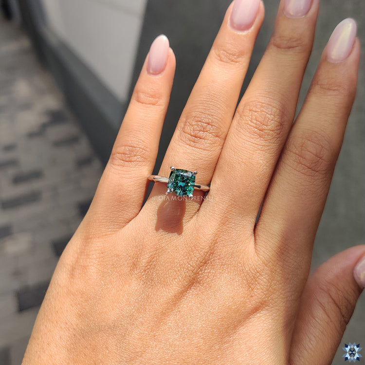 Handmade jewelry with cushion moissanite in a bold solitaire design.