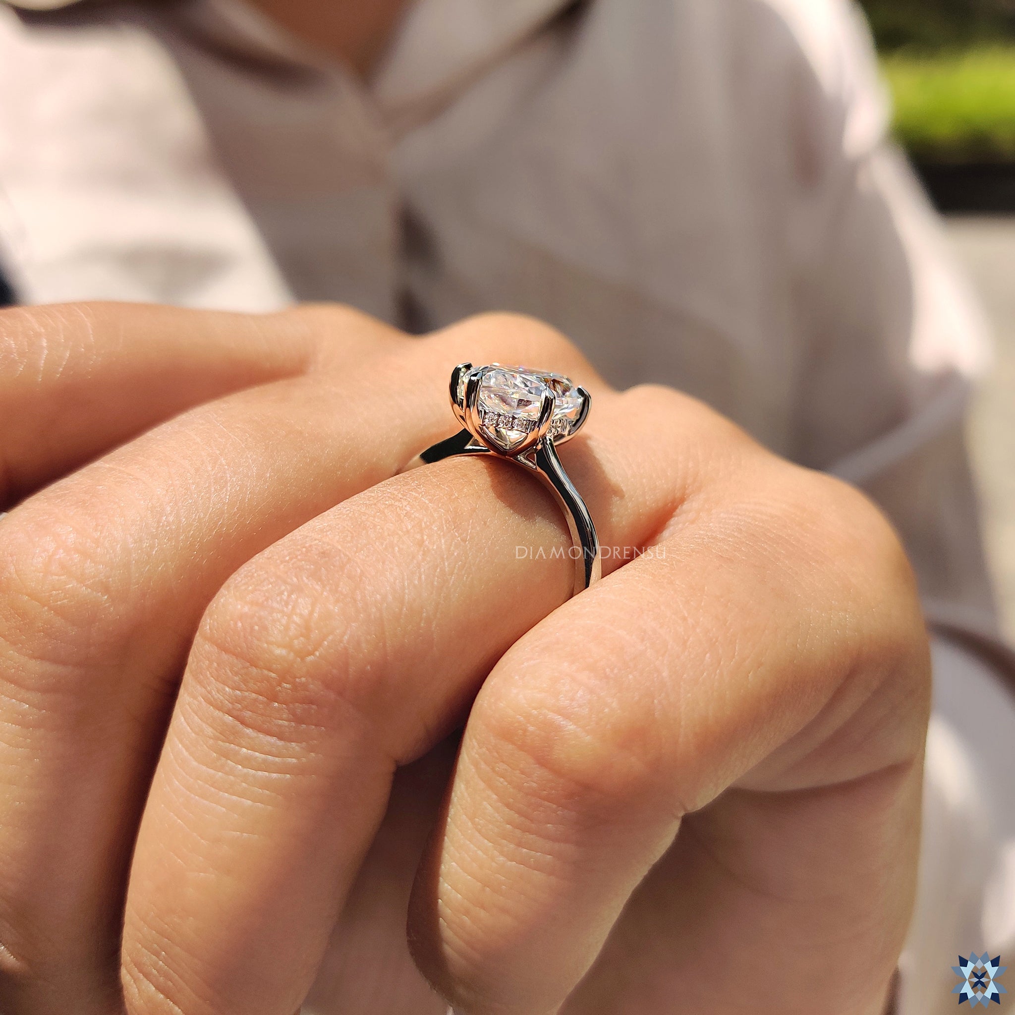 Moissanite for an engagement ring featuring marquise cut and hidden halo elegance.