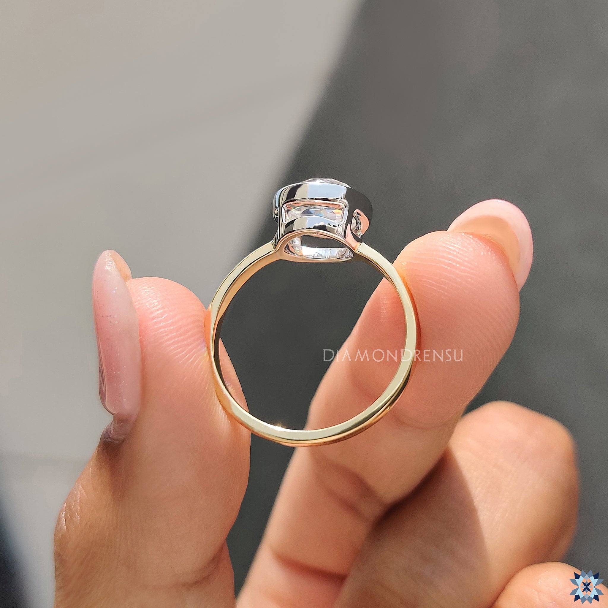 Handmade rose cut Moissanite ring in a sleek white and yellow gold setting.